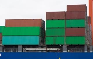 containers of various sizes on a cargo ship