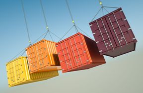 four shipping containers suspended in air